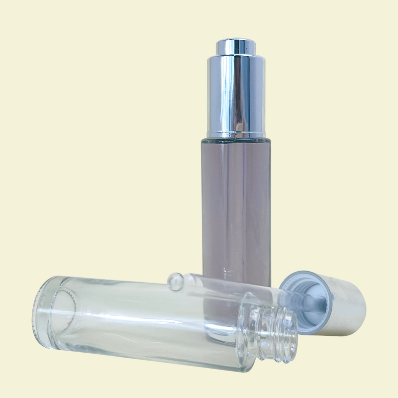 New Design 30ml Round Thick Bottom Glass Dropper Bottle Cosmetic Serum Transparent Push Dropper Essential Oil Glass Bottle